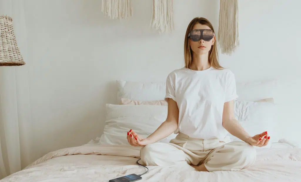 woman meditating with htc vive flow
